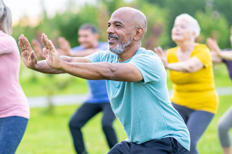 An older man at a Tai Chi class.